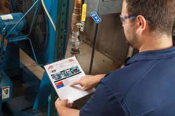 A worker reviews a lockout tagout procedure audit.