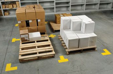 Corners marked with floor tap indicating where pallets of materials should be placed.