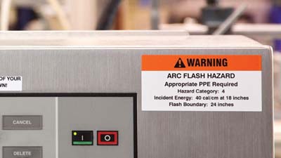 An arc flash label with preprinted warning header.