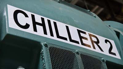 An industrial chiller with an all-weather label.