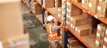 Man managing inventory with Brady handheld RFID scanner